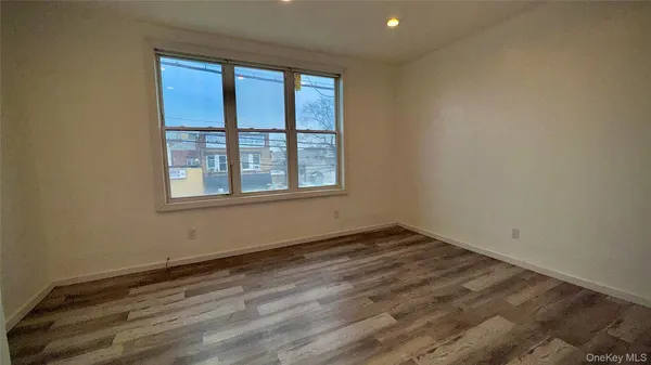 a view of a living room with furniture and a flat screen tv