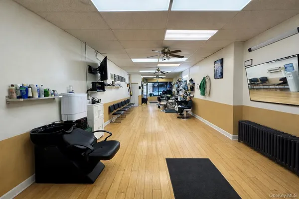 a living room with lots of furniture and gym equipment