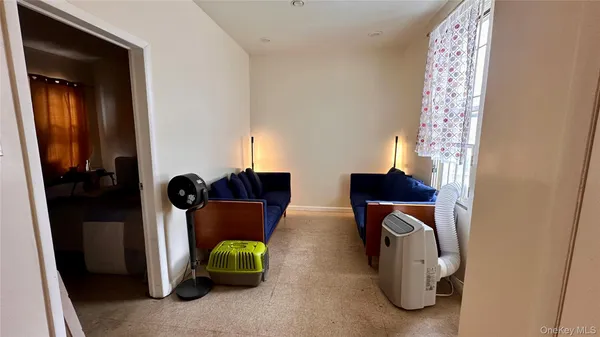 a living room with a couch and a window