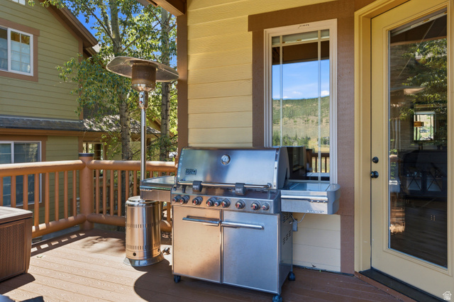 3148 Lower Saddleback Road Park City, UT 84098 - Photo 25 of 67 Outdoor deck featuring wood-finish flooring, log-style railings, and a direct entrance via a glass-paneled door
