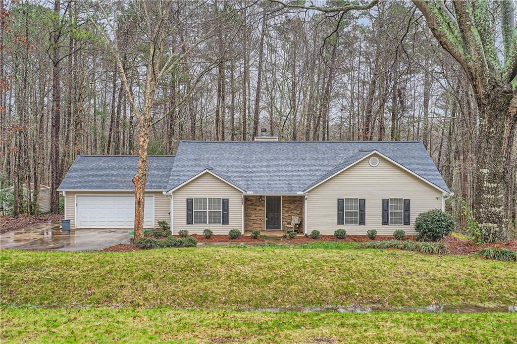 1870 River Bluff Road Monroe, GA 30656 - Photo 1 of 1 a view of a yard in front of a house with large trees