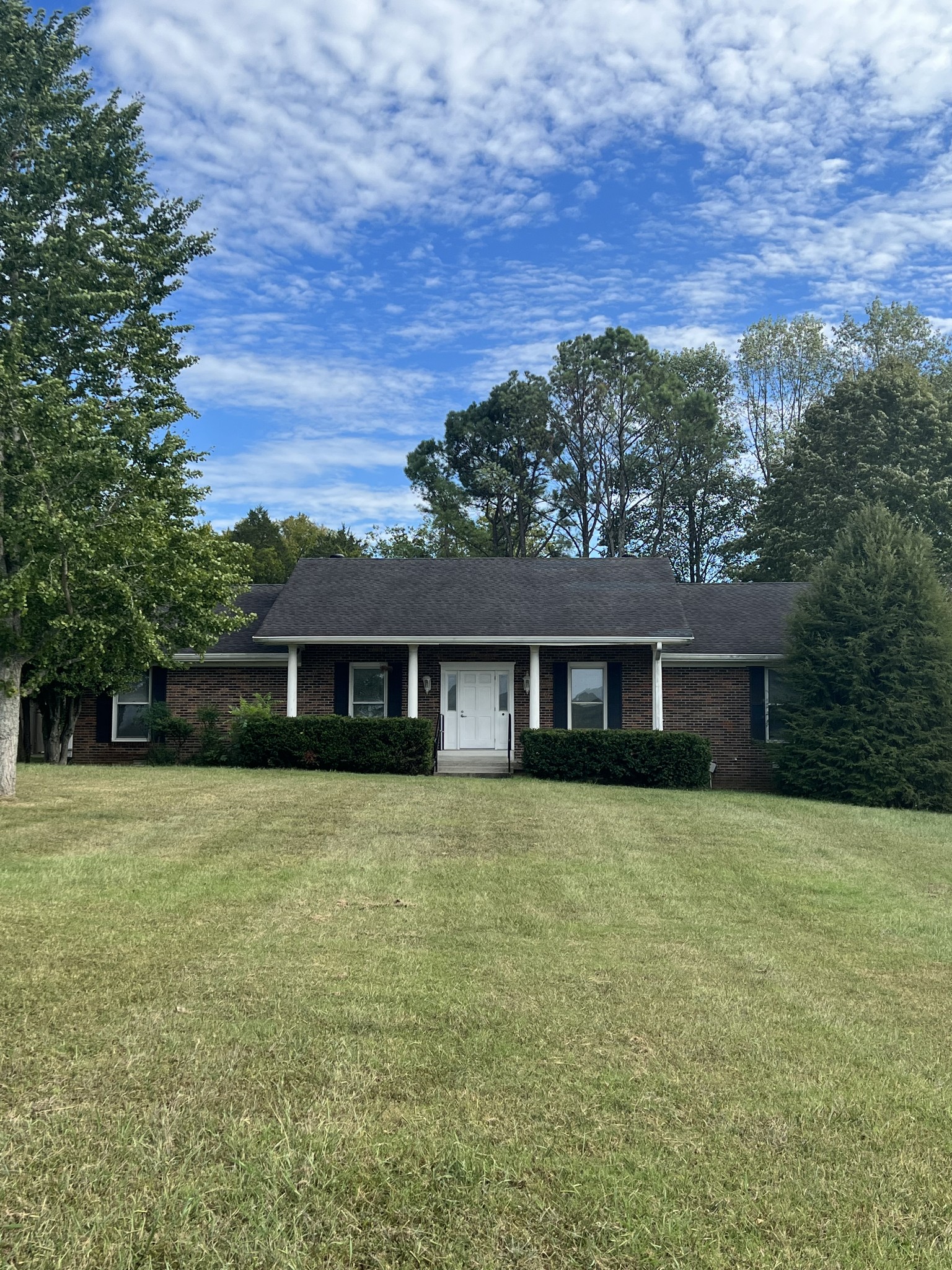 front view of a house with a yard