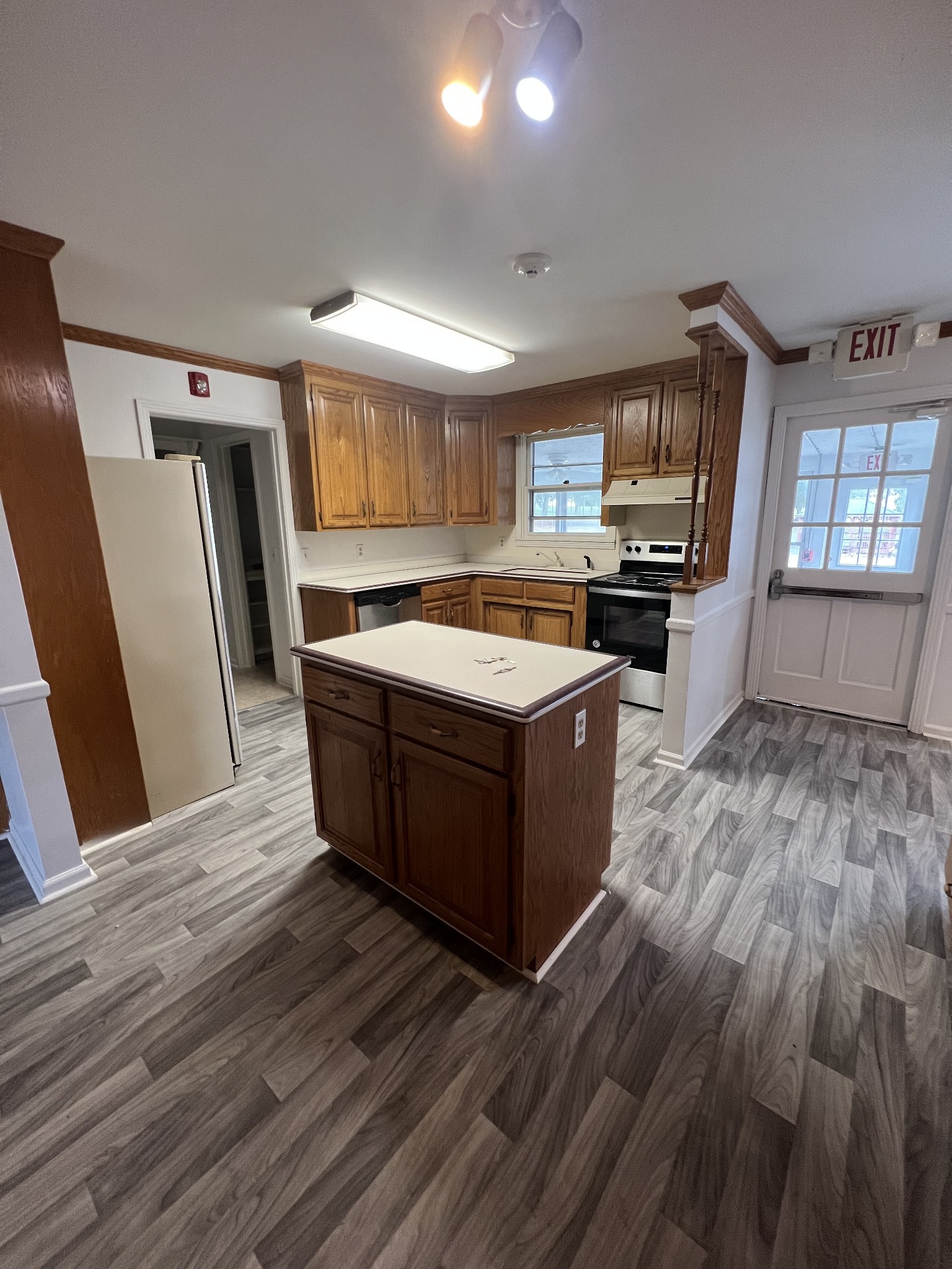 5588 Lebanon Road Lebanon, TN 37087 - Photo 15 of 43 a large kitchen with wooden floors and stainless steel appliances