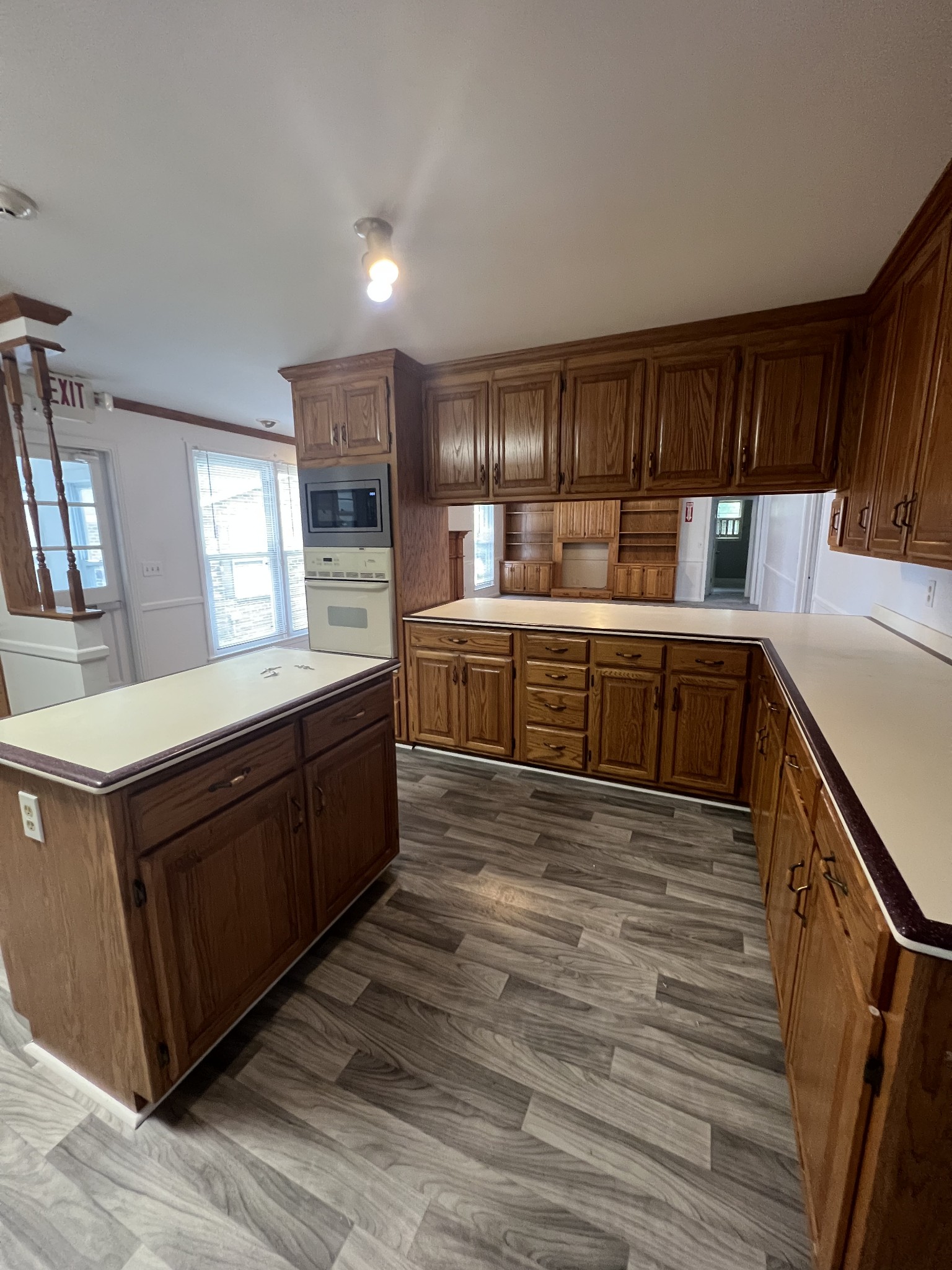 5588 Lebanon Road Lebanon, TN 37087 - Photo 16 of 43 a large kitchen with stainless steel appliances granite countertop a large counter top a wooden floors and white cabinets
