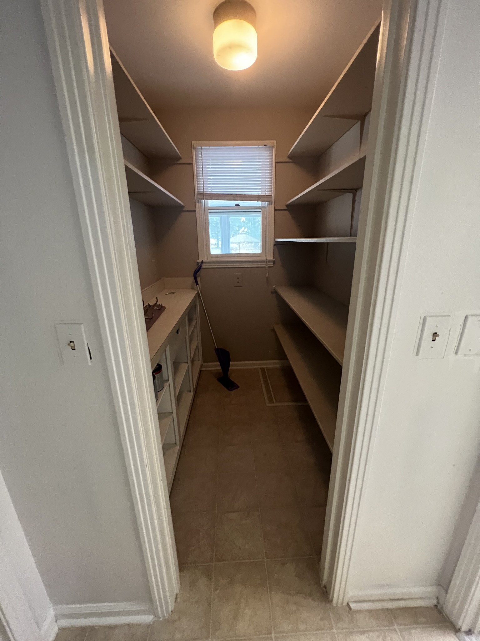 5588 Lebanon Road Lebanon, TN 37087 - Photo 18 of 43 a view of walk in closet with window and stairs