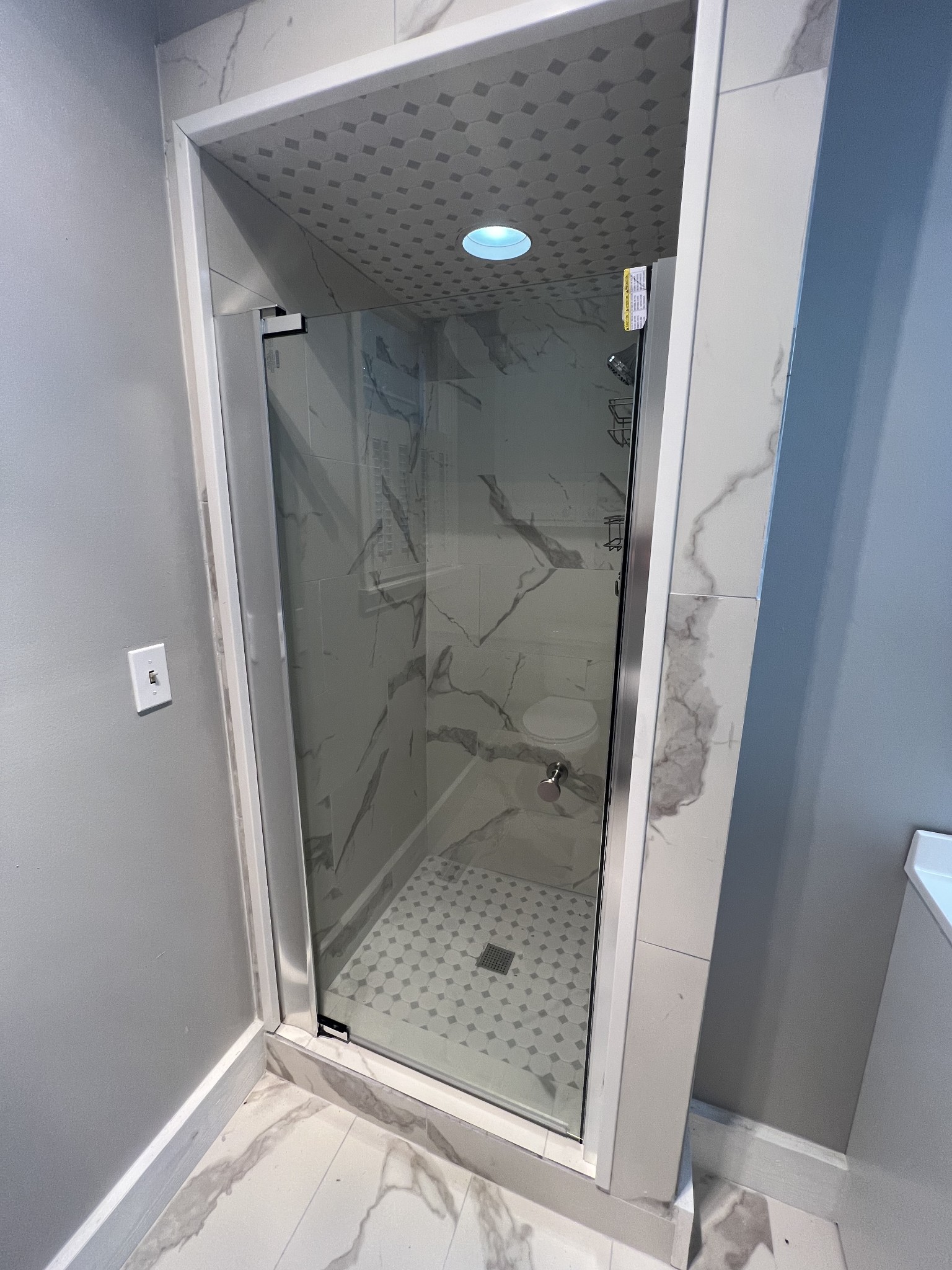 5588 Lebanon Road Lebanon, TN 37087 - Photo 8 of 43 a bathroom with a glass shower door