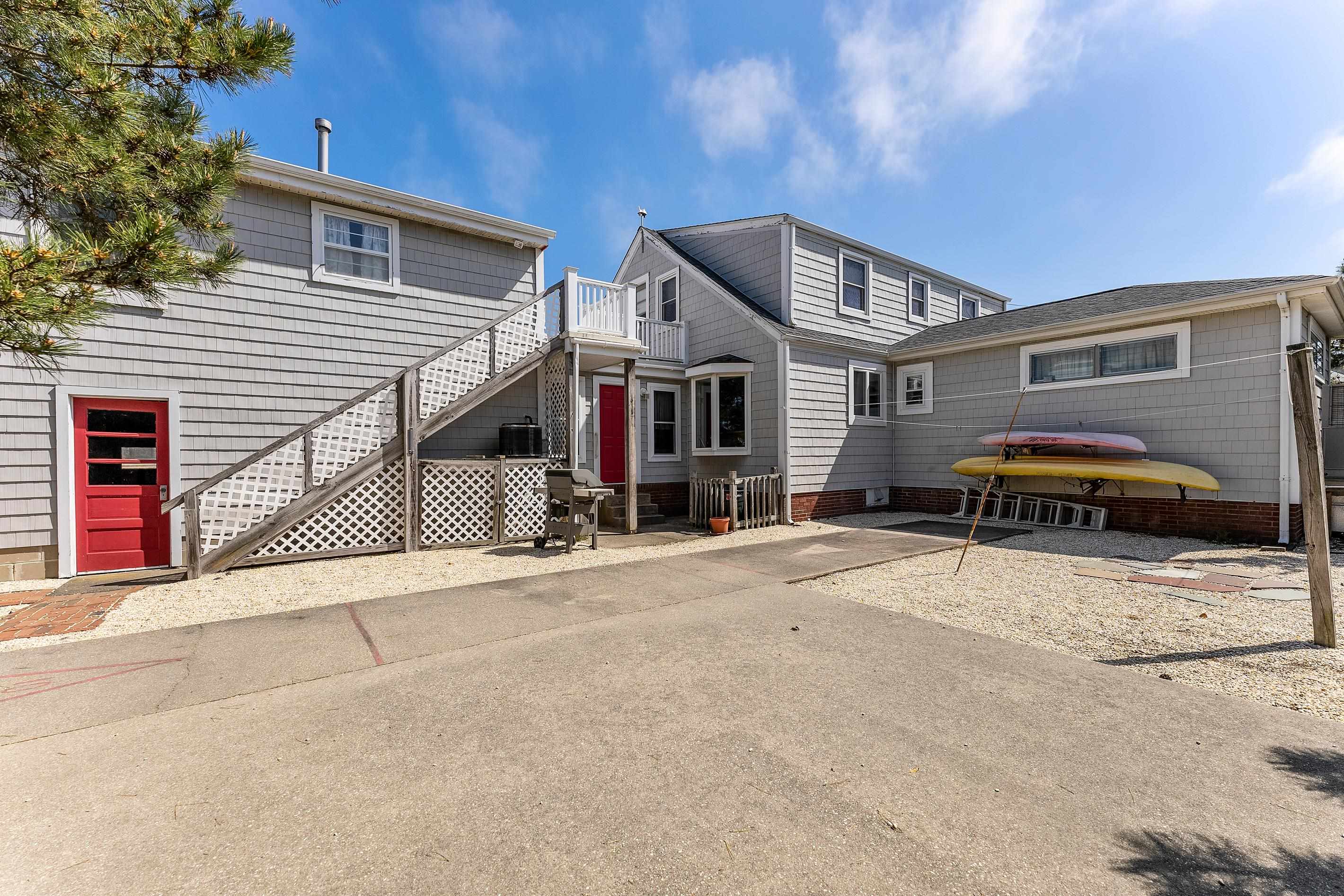 10823 1st Stone Harbor, NJ 08247 - Photo 8 of 8 a front view of a house with a yard and garage
