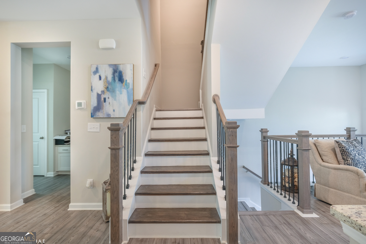 2247 Pink Hawthorn Drive Buford, GA 30518 - Photo 11 of 43 a view of entryway and hall with wooden floor