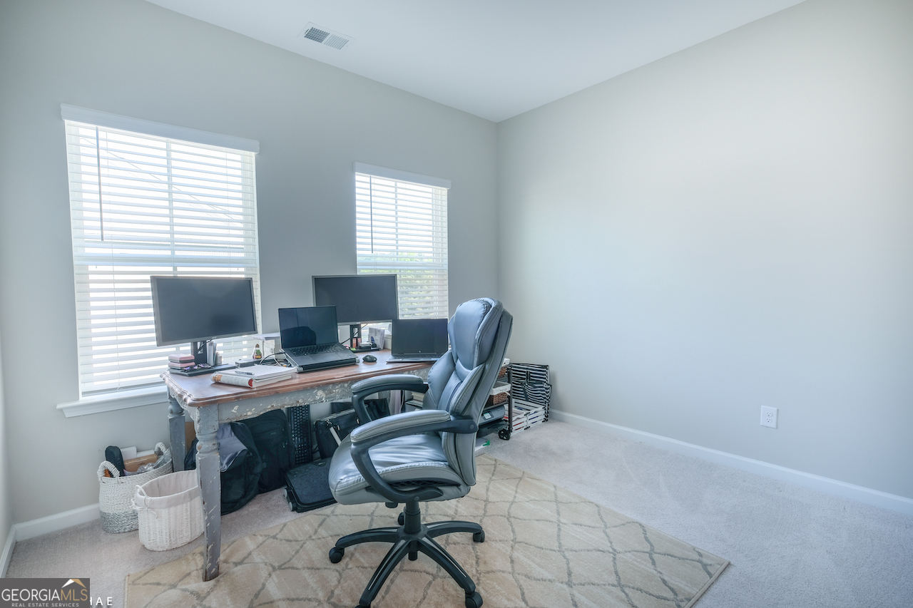 2247 Pink Hawthorn Drive Buford, GA 30518 - Photo 15 of 43 a view of a workspace with furniture and a window