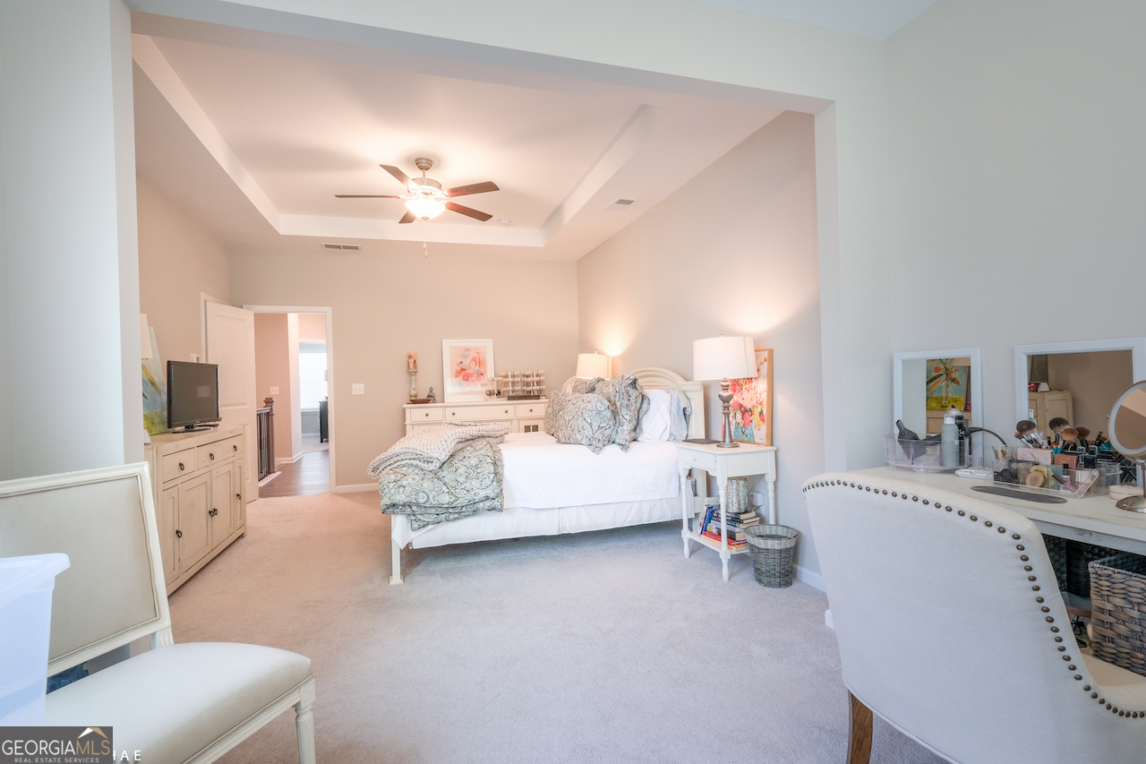 2247 Pink Hawthorn Drive Buford, GA 30518 - Photo 17 of 43 a living room with furniture and a chandelier