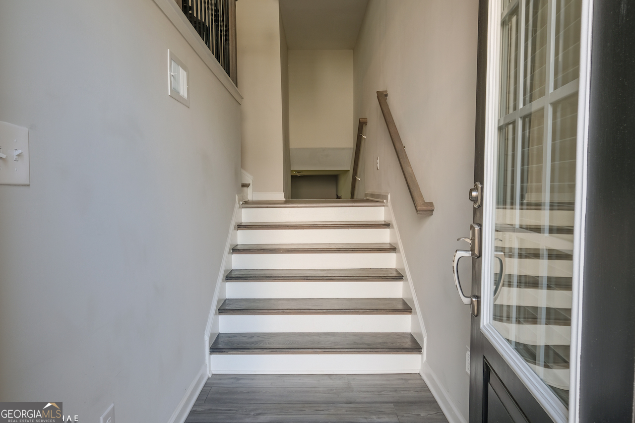 2247 Pink Hawthorn Drive Buford, GA 30518 - Photo 3 of 43 a view of staircase with white walls and a window