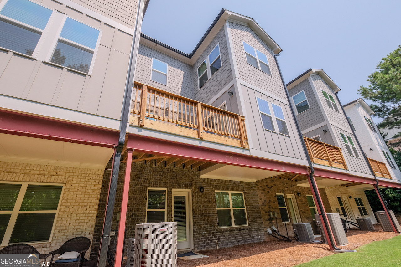 2247 Pink Hawthorn Drive Buford, GA 30518 - Photo 38 of 43 a view of a building with a glass door