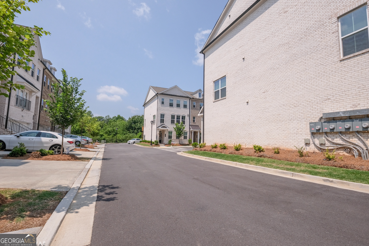 2247 Pink Hawthorn Drive Buford, GA 30518 - Photo 39 of 43 a view of a street with cars