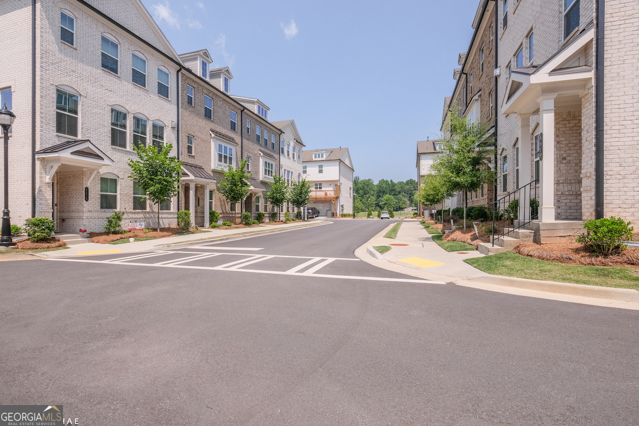 2247 Pink Hawthorn Drive Buford, GA 30518 - Photo 40 of 43 a view of a building with a street