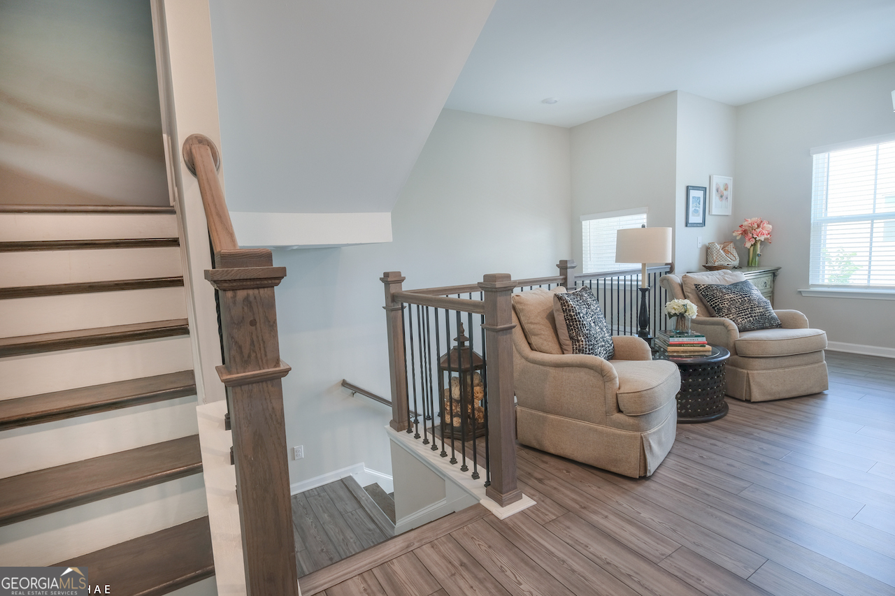 2247 Pink Hawthorn Drive Buford, GA 30518 - Photo 4 of 43 a living room with furniture and a wooden floor