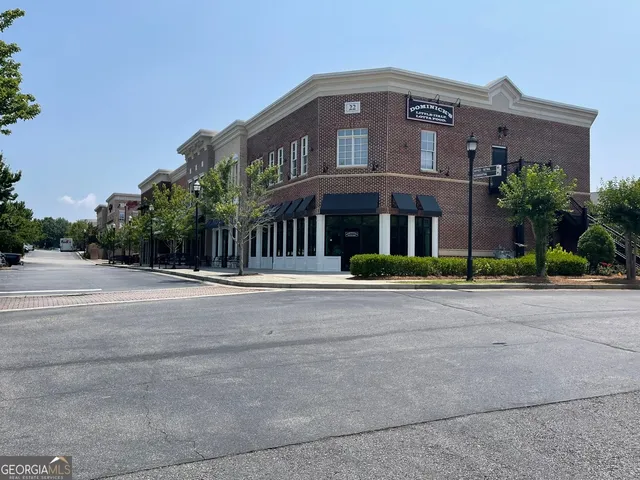 a view of a garden with flowers and trees