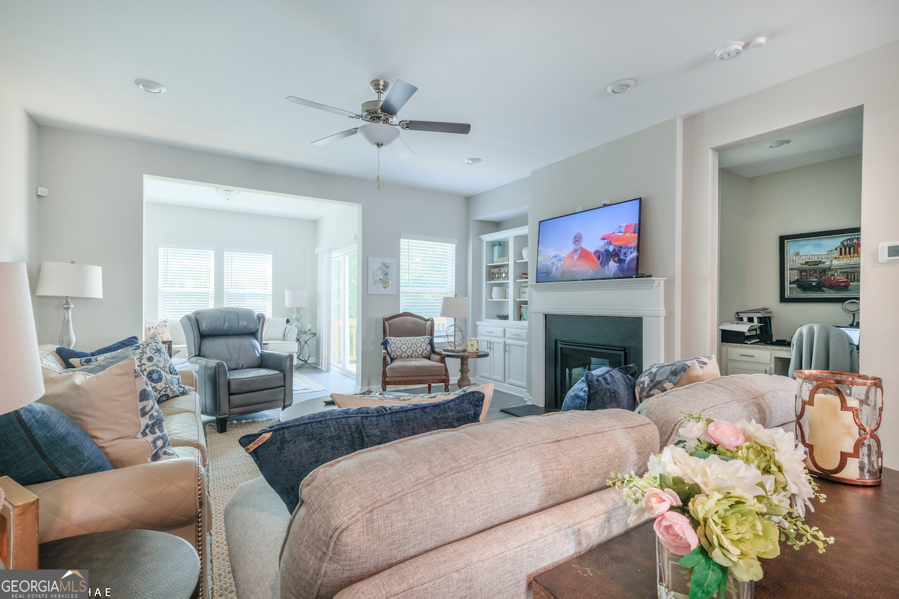 2247 Pink Hawthorn Drive Buford, GA 30518 - Photo 7 of 43 a living room with furniture fireplace and a window