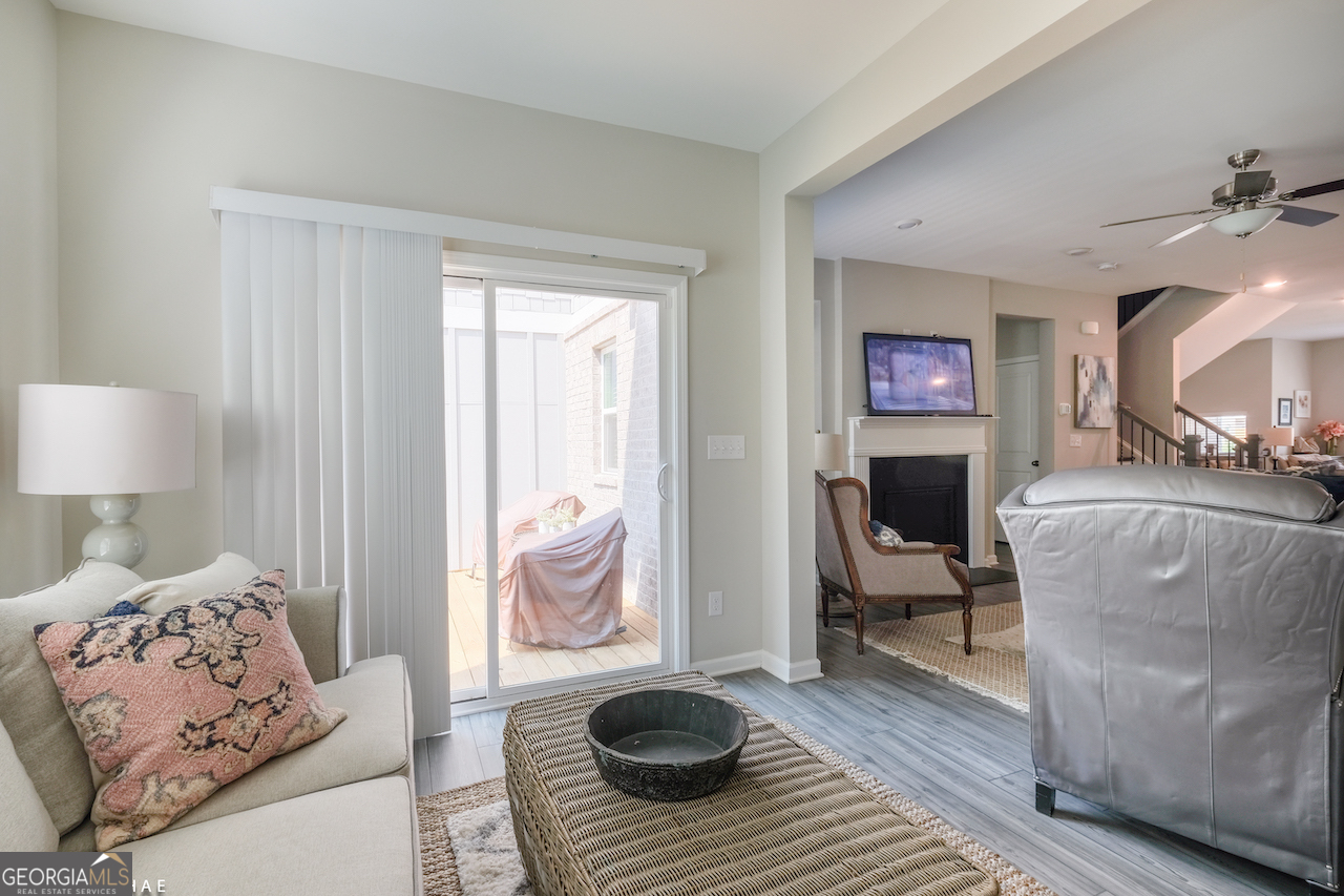 2247 Pink Hawthorn Drive Buford, GA 30518 - Photo 8 of 43 a living room with furniture and a fireplace