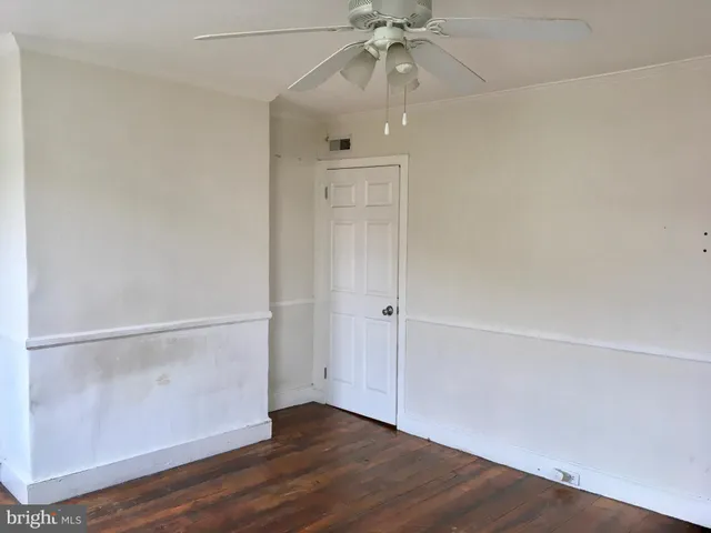 a utility room with cabinets washer and dryer