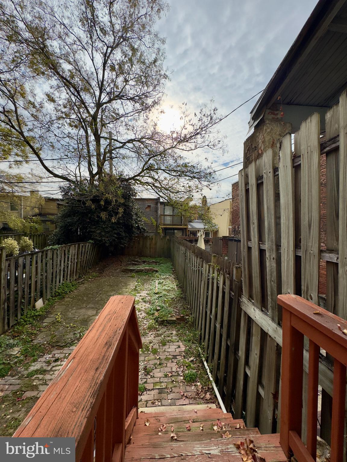 665 Portland Street Baltimore, MD 21230 - Photo 19 of 19 a view of balcony with wooden floor and fence