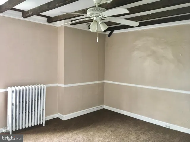 a kitchen with refrigerator and window