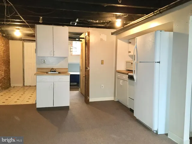 a view of a hallway view with wooden floor and staircase