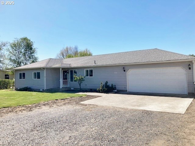 3202 Northeast Riverside Avenue Pendleton, OR 97801 - Photo 1 of 22 a front view of a house with a yard and garage