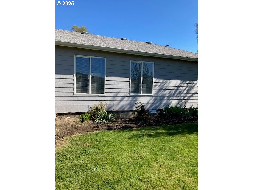3202 Northeast Riverside Avenue Pendleton, OR 97801 - Photo 13 of 22 a view of a house with a yard