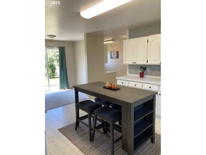 3202 Northeast Riverside Avenue Pendleton, OR 97801 - Photo 4 of 22 a view of a dining room with a table and chairs