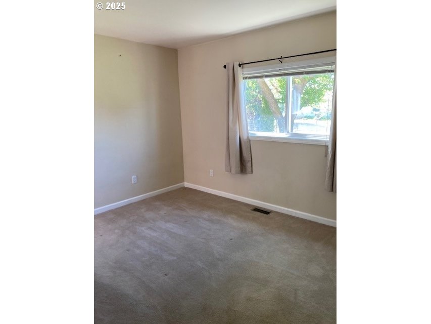 3202 Northeast Riverside Avenue Pendleton, OR 97801 - Photo 7 of 22 a view of an empty room with a window
