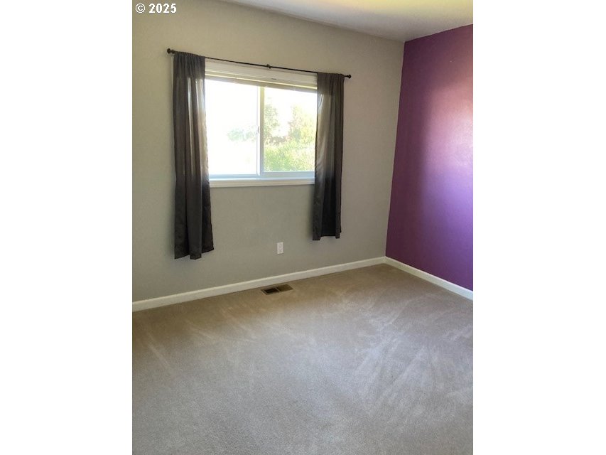 3202 Northeast Riverside Avenue Pendleton, OR 97801 - Photo 8 of 22 a view of an empty room with a window