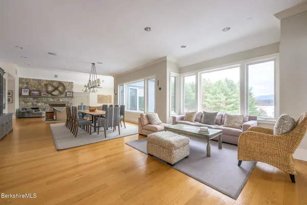 a living room with furniture and large windows