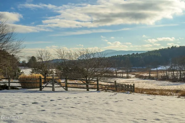 a view of a house with a snow on the road