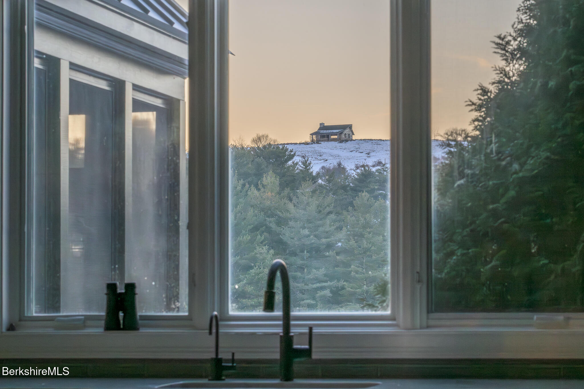 58 Round Hill Road Great Barrington, MA 01230 - Photo 28 of 79 a view of a balcony with a door and a bench