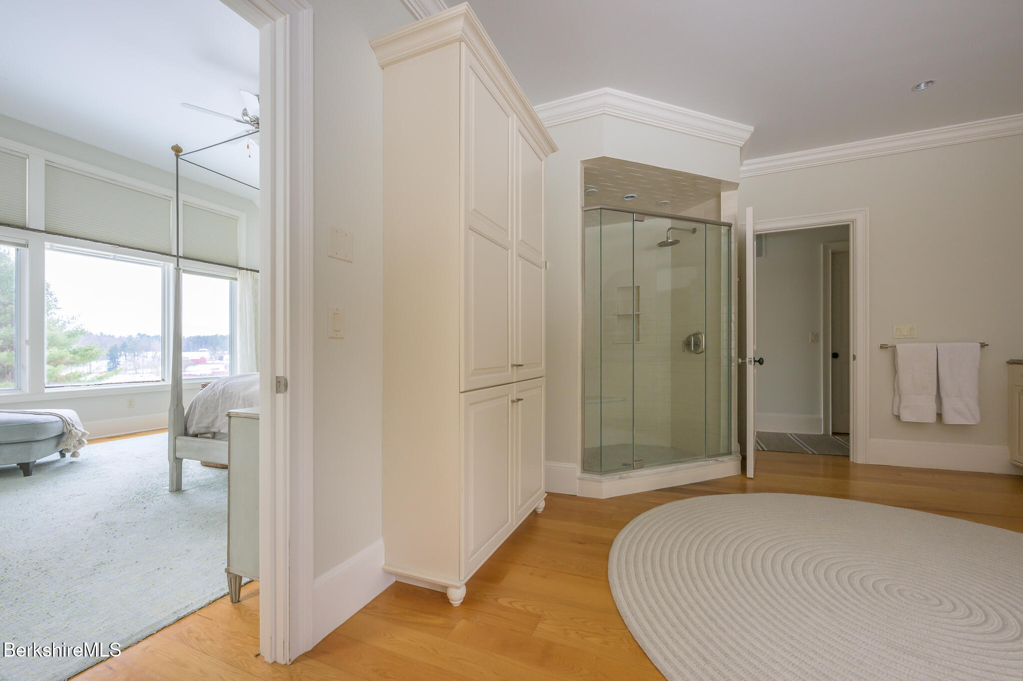 58 Round Hill Road Great Barrington, MA 01230 - Photo 37 of 79 a bedroom with a bed and a glass door shower