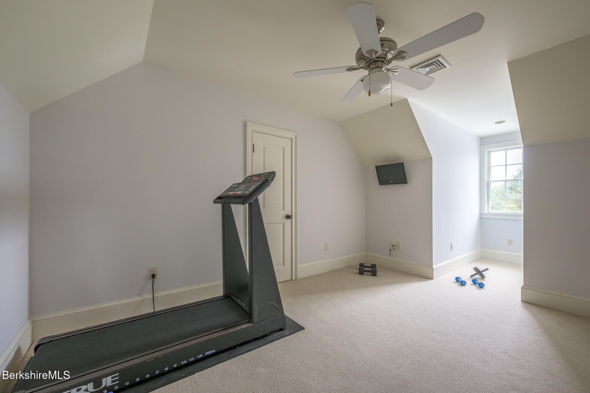 58 Round Hill Road Great Barrington, MA 01230 - Photo 49 of 79 a room with gym equipment and a window