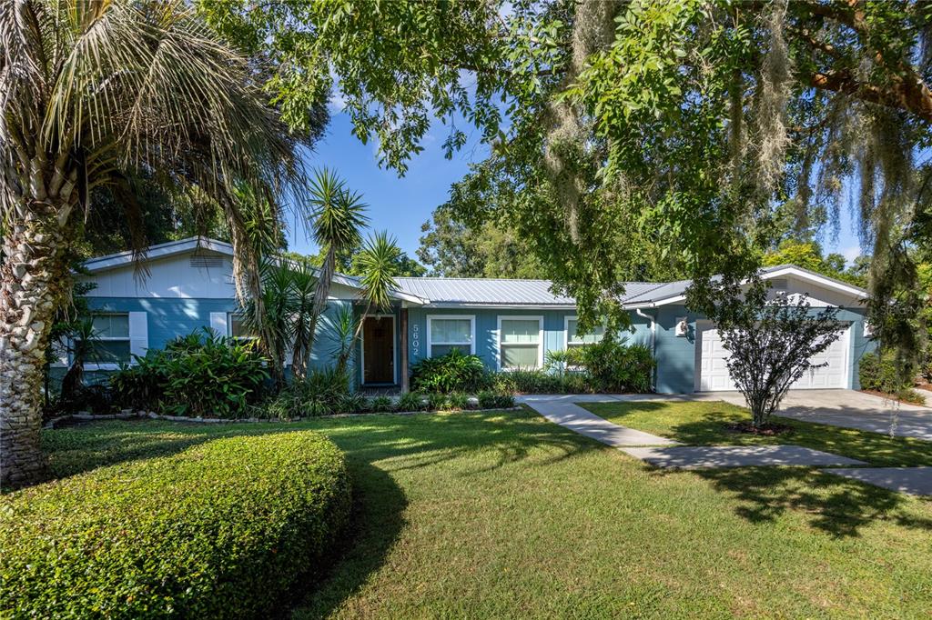 5602 Southwest 35th Way Gainesville, FL 32608 - Photo 1 of 1 a front view of a house with a garden