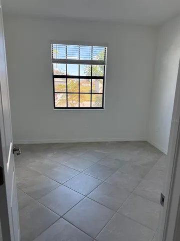 an empty room with a empty space and window