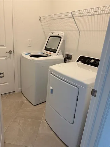a utility room with dryer and washer