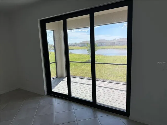 a view of a room that has a large window