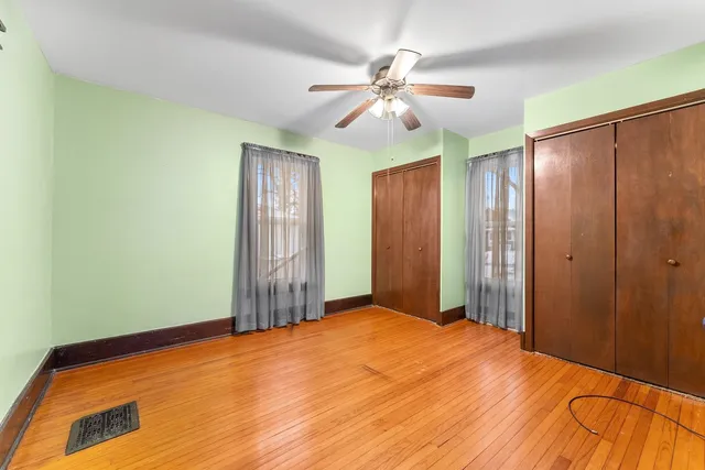 a view of a room with a ceiling fan