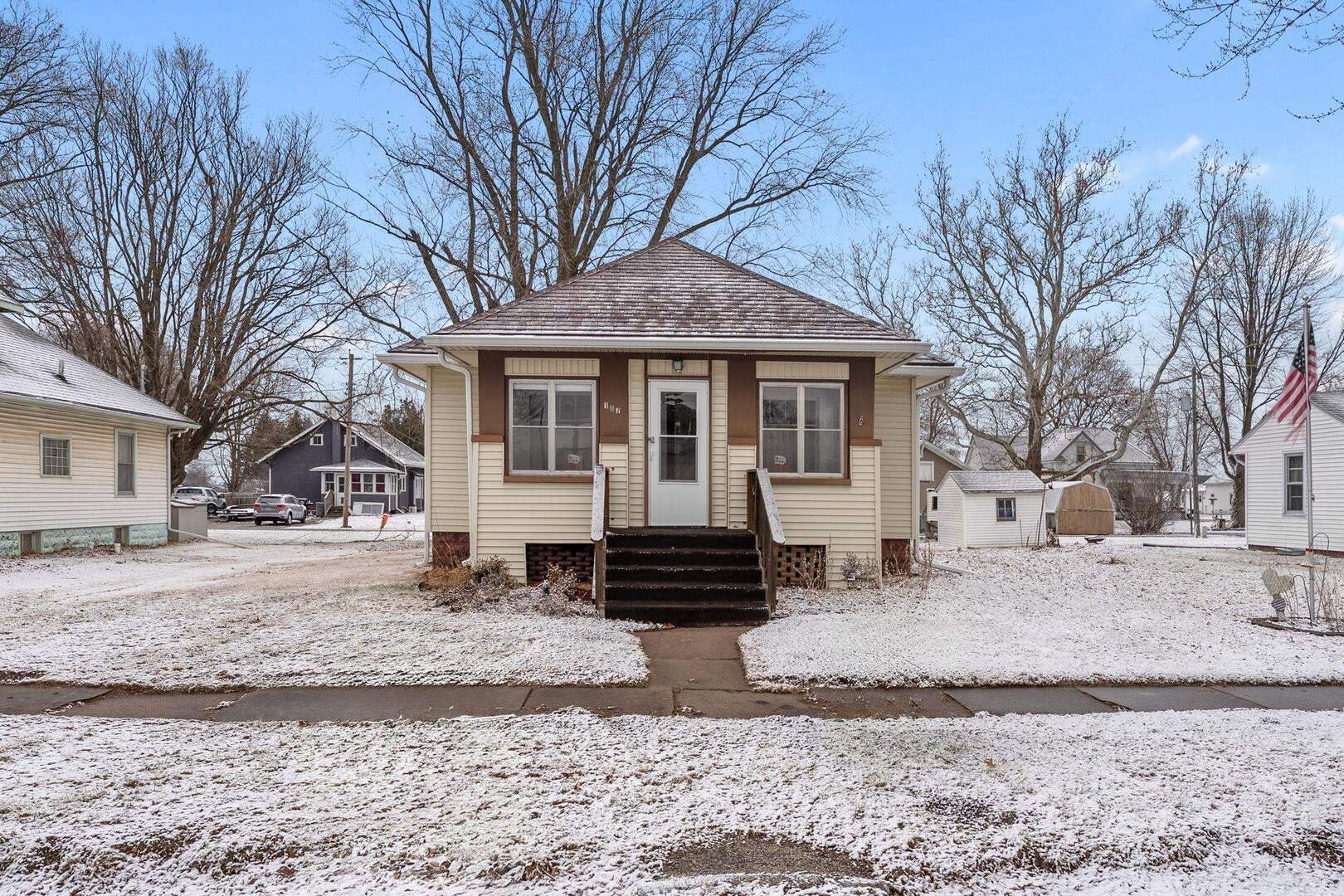 107 East Liberty Street Joy, IL 61260 - Photo 18 of 19 a front view of a house with a yard