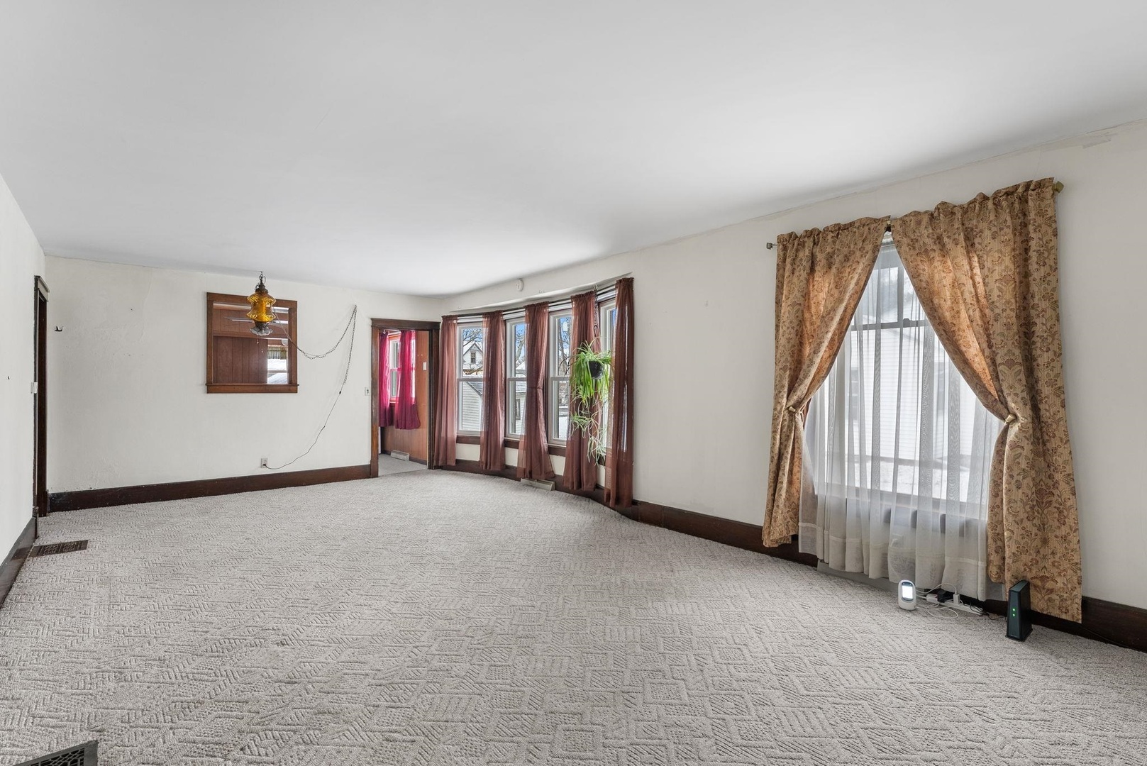 107 East Liberty Street Joy, IL 61260 - Photo 4 of 19 an empty room with windows