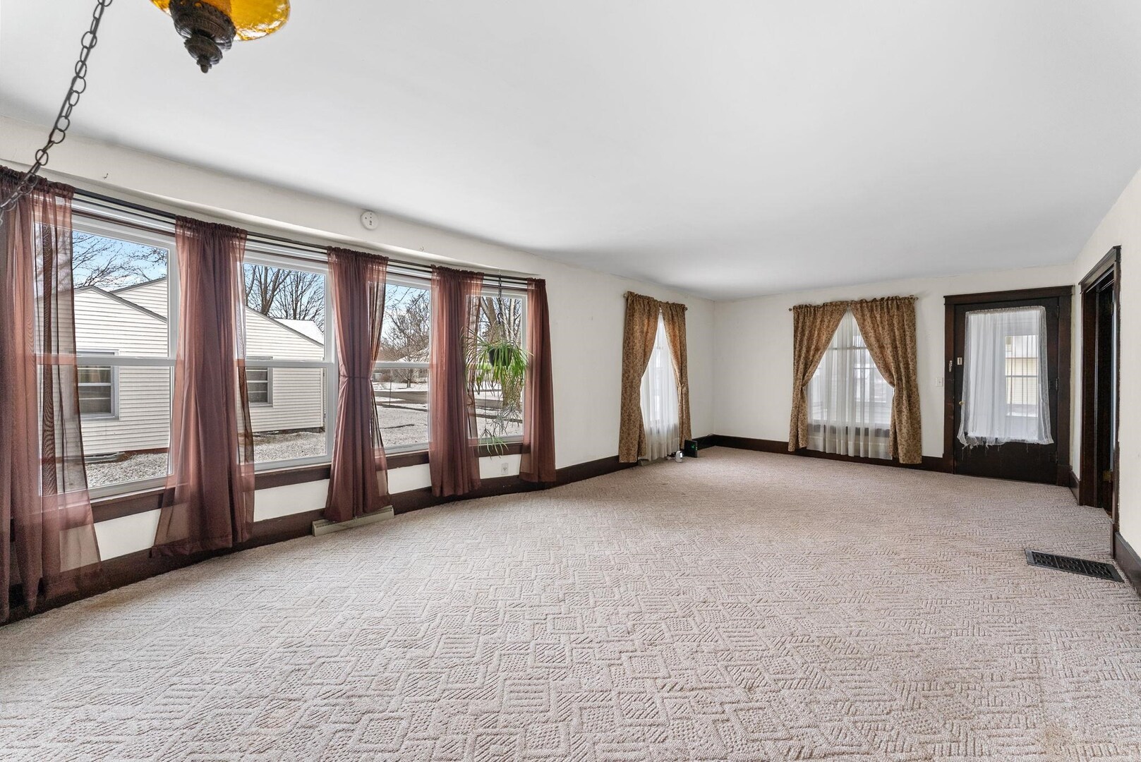 107 East Liberty Street Joy, IL 61260 - Photo 7 of 19 an empty room with windows & cabinet