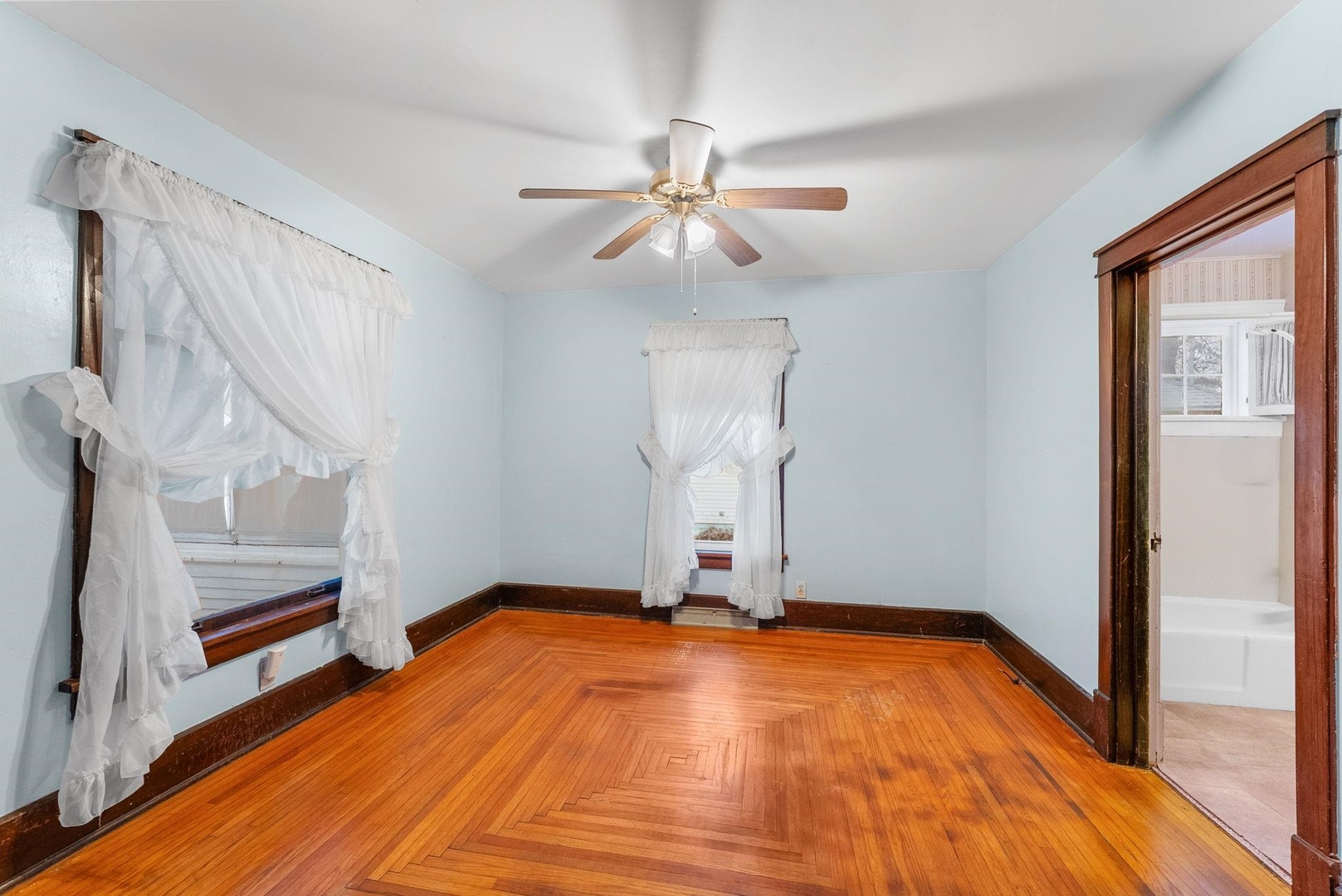 107 East Liberty Street Joy, IL 61260 - Photo 8 of 19 a view of empty room with stairs and wooden floor