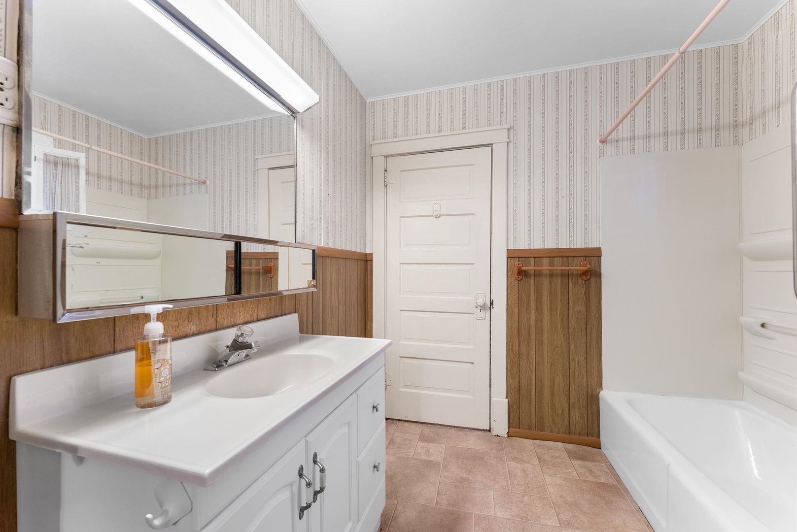107 East Liberty Street Joy, IL 61260 - Photo 10 of 19 a bathroom with a sink and a tub