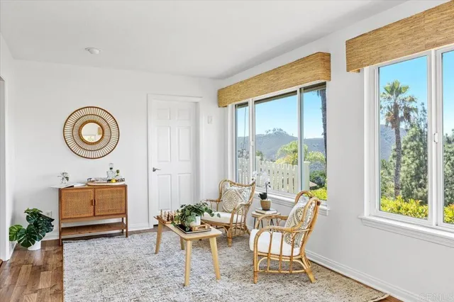 a dining room with furniture and a window