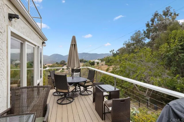 a view of balcony with couch and chairs