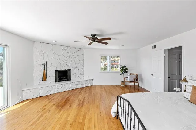 a view of a livingroom with an empty space and a fireplace