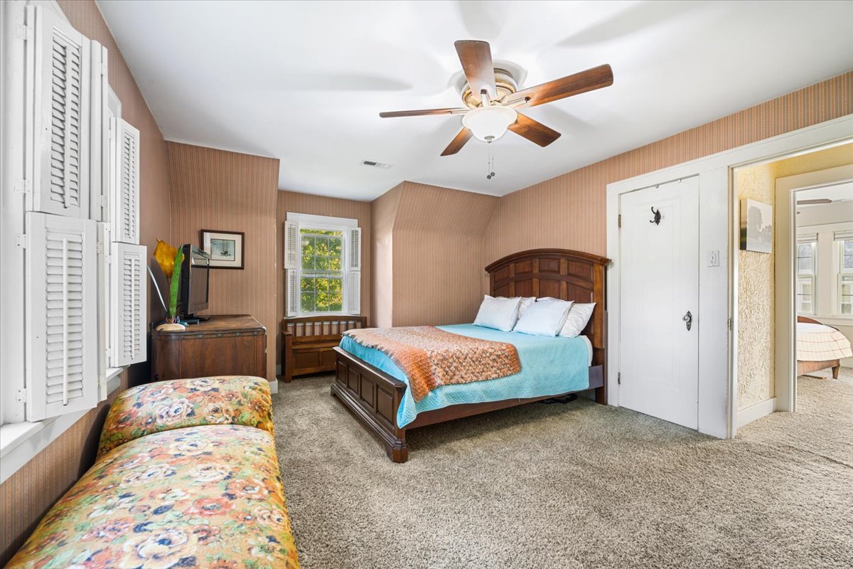 501 Dodson Street Geneva, IL 60134 - Photo 12 of 23 a bedroom with a bed mirror and window